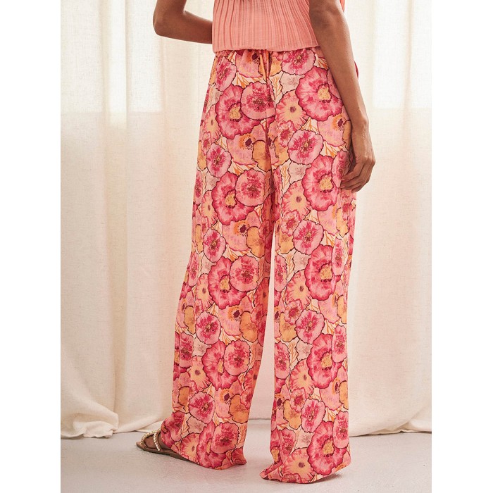 Pantalón largo de mujer Yanra. Colección SS24 NKN Nekane en candelascloset. Estilo palazzo con estampado floral y bolsillos.